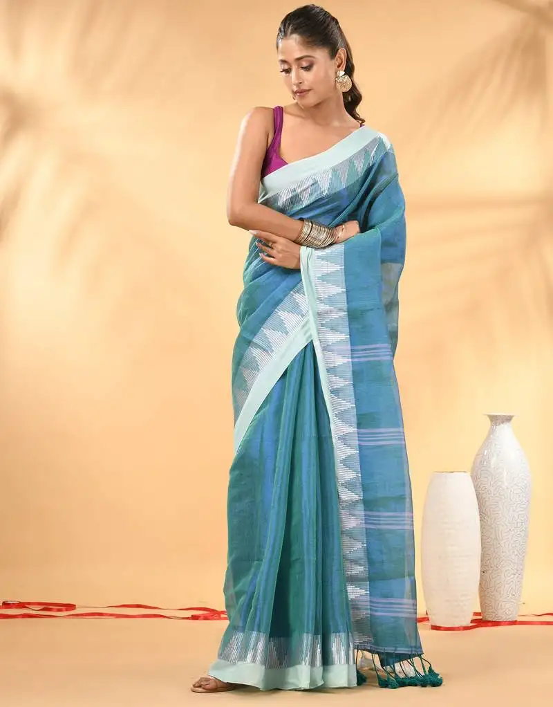 Sea green and white tissue saree with woven geometric border