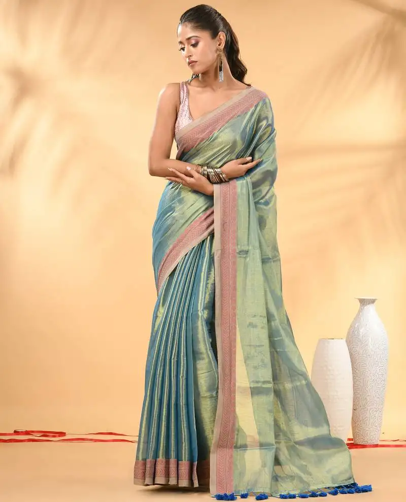Sky blue golden glow tissue saree
