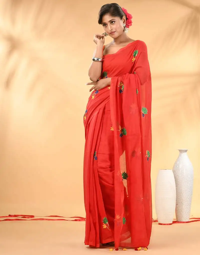 Red mulmul cotton saree with floral embroidery and tassel detailing