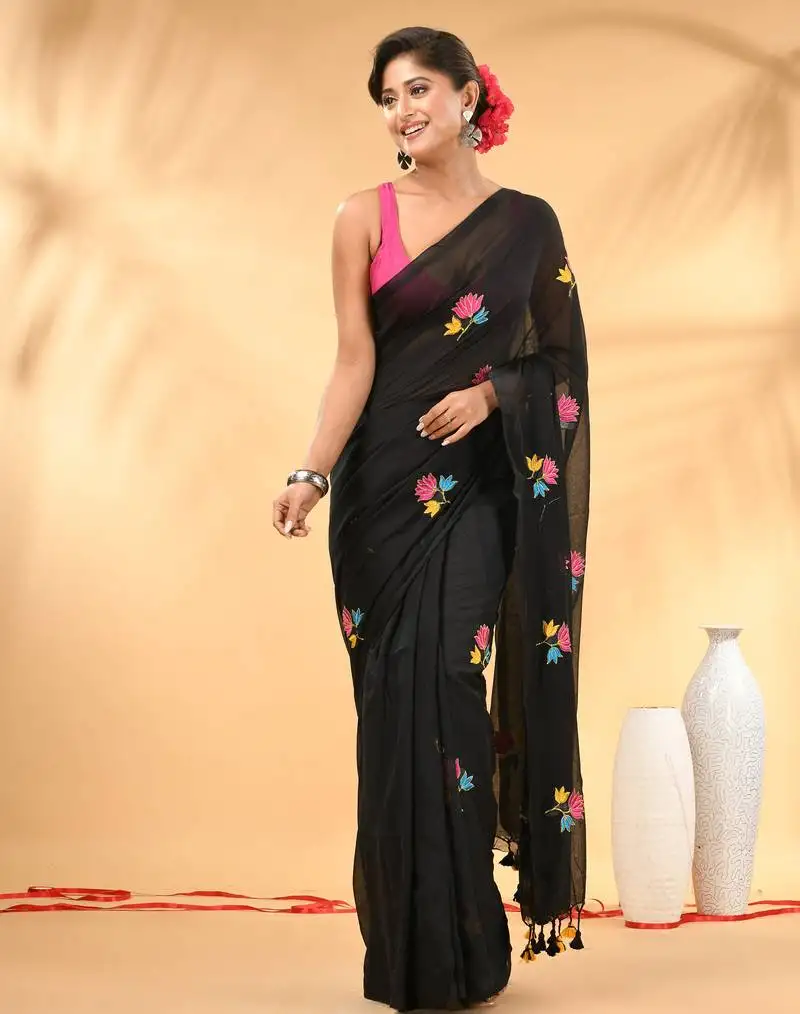 Black mulmul cotton saree with floral embroidery and tassel detailing