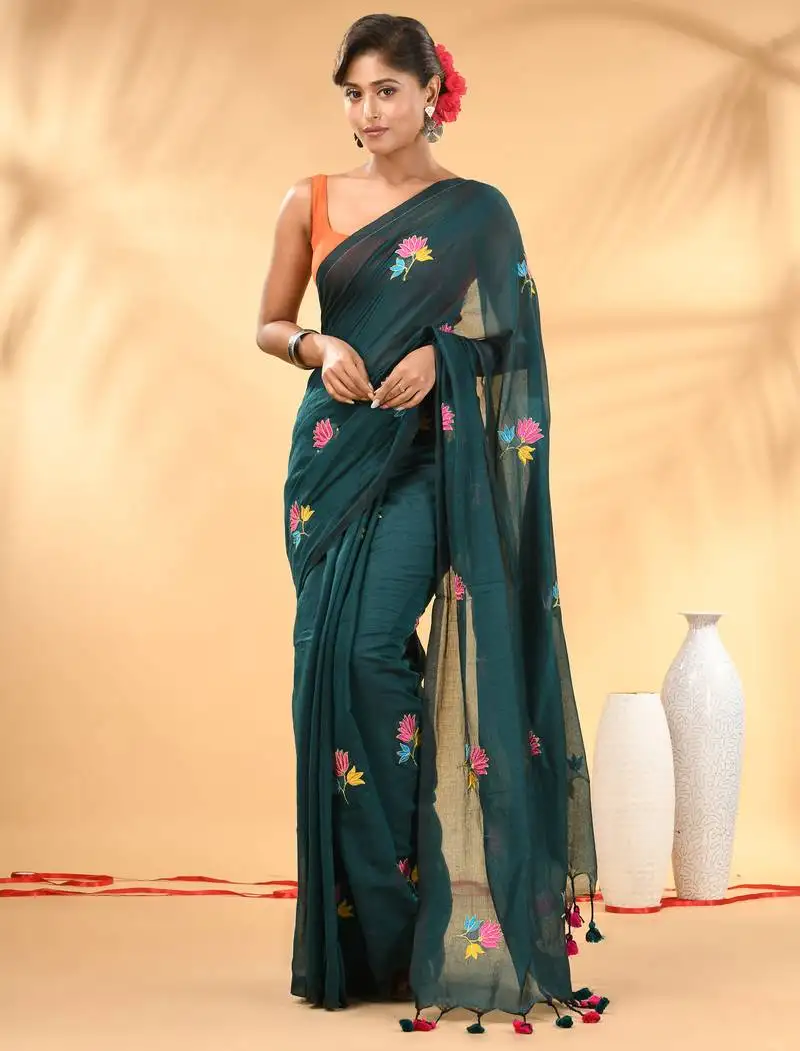 Teal mulmul cotton saree with floral embroidery and tassel detailing
