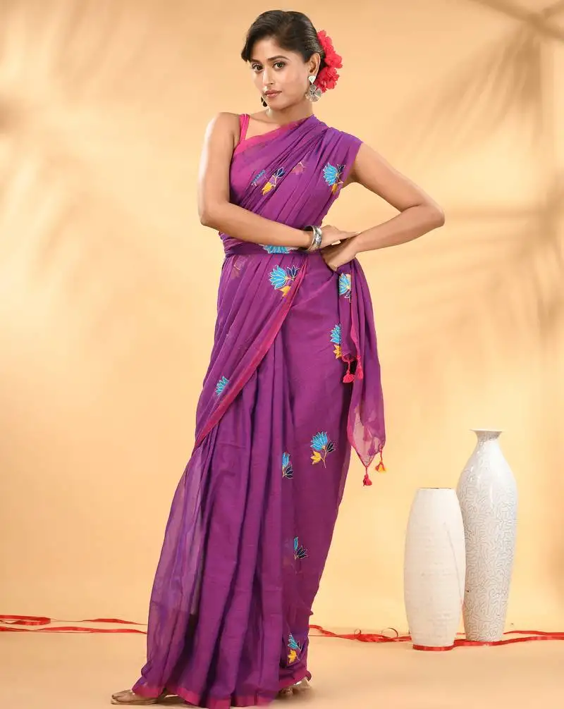 Purple mulmul cotton saree with floral embroidery and tassel detailing