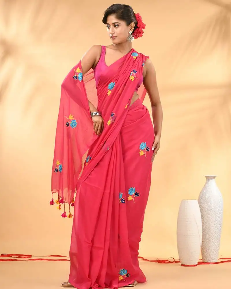 Rani pink mulmul cotton saree with floral embroidery and tassel detailing