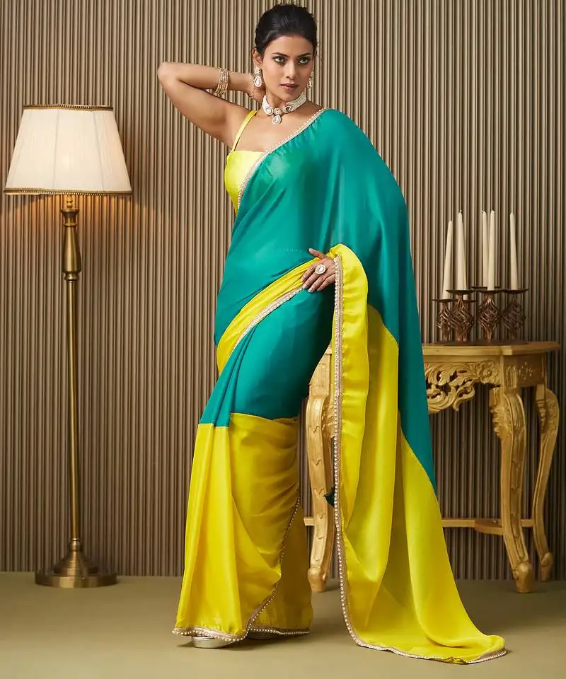 Teal color chiffon fabric motiwork lace colorblocked ceremonial saree
