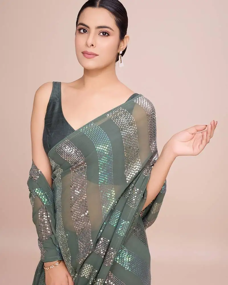 Embellished pista color bollywood georgette saree with unstiched blouse