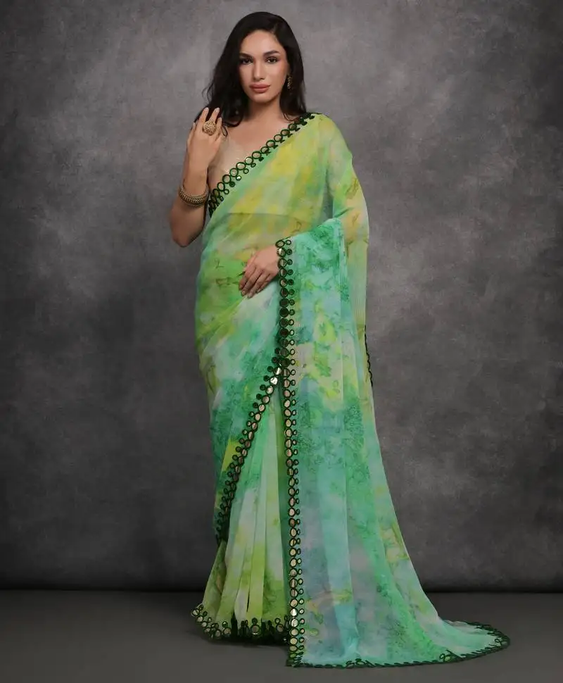 Light green printed georgette saree with mirror work border
