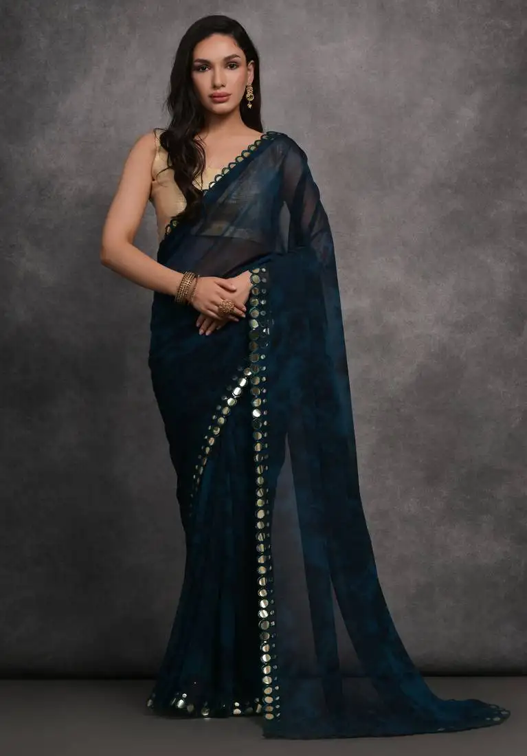 Dark blue printed georgette saree with mirror work border