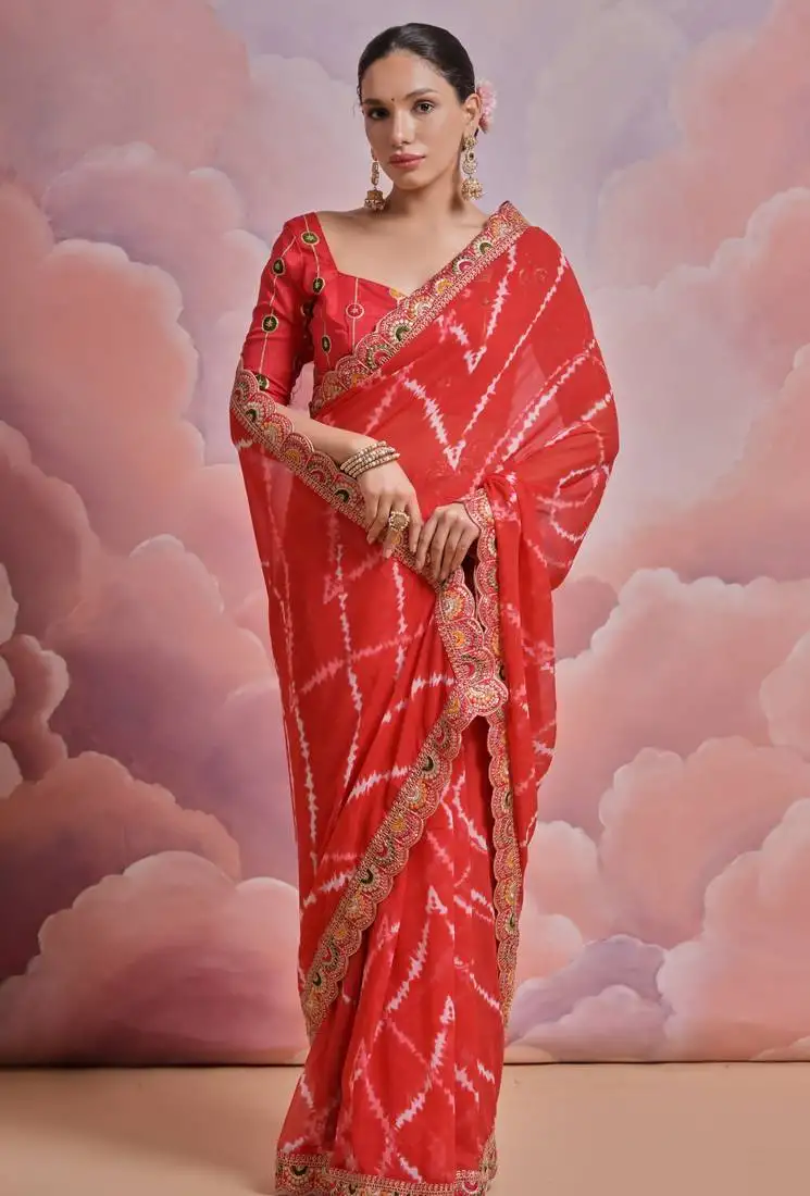 Red tie and dye printed georgette saree with embroidered border