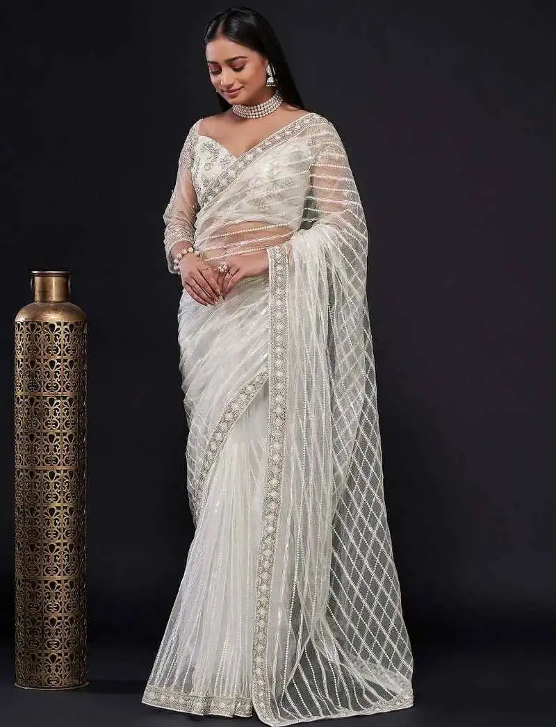 White sequin work net saree with blouse