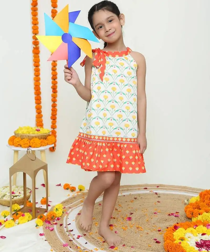 Yellow and orange dual ruffle dress with tie bow detailing ::Organic cotton