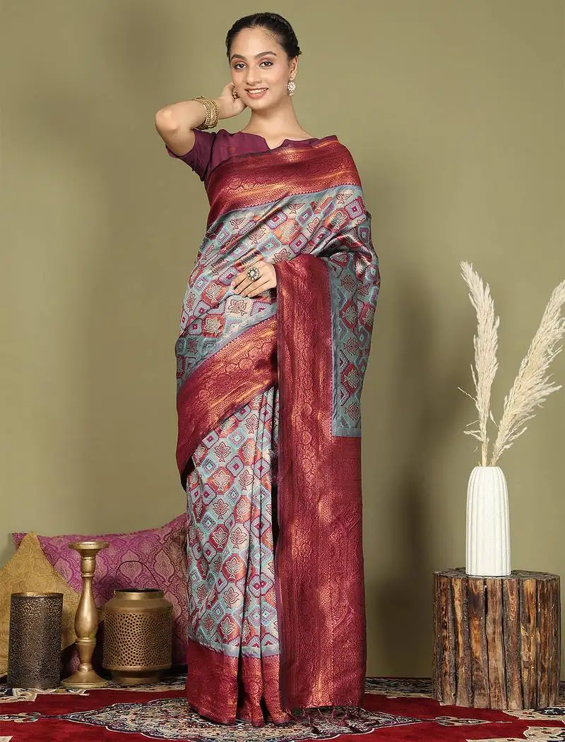 Red and teal silk blend saree with rich woven pallu