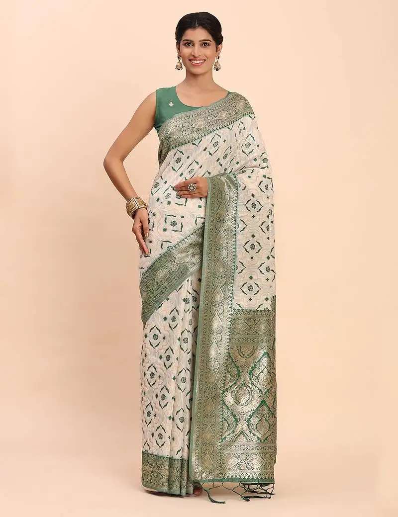 Cream linen cotton saree with green pallu and contrast blouse piece