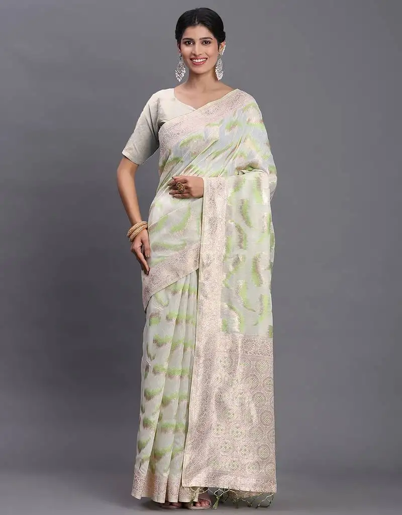 Cream linen cotton saree with light green pallu and contrast blouse piece