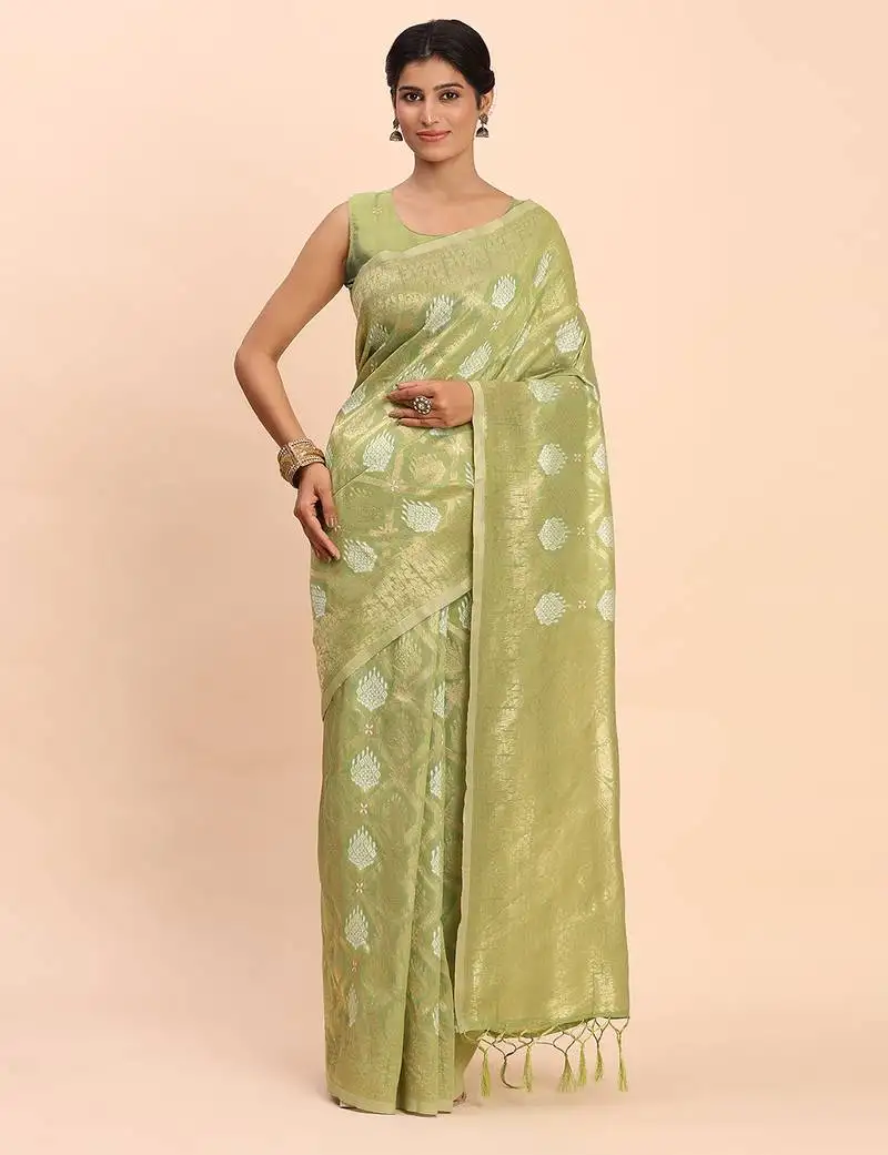 Light green linen cotton saree with silver zari weave and tassels