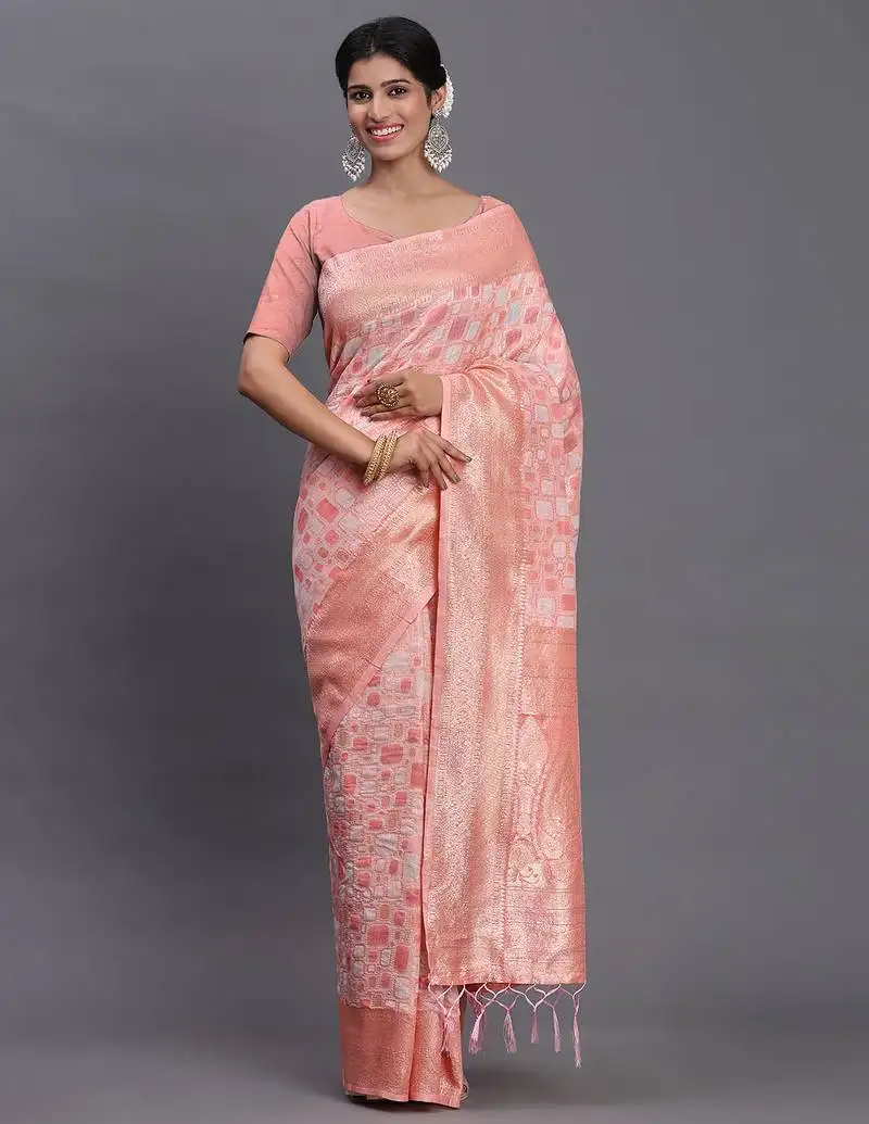 Peach linen cotton saree with silver zari weave and tassels