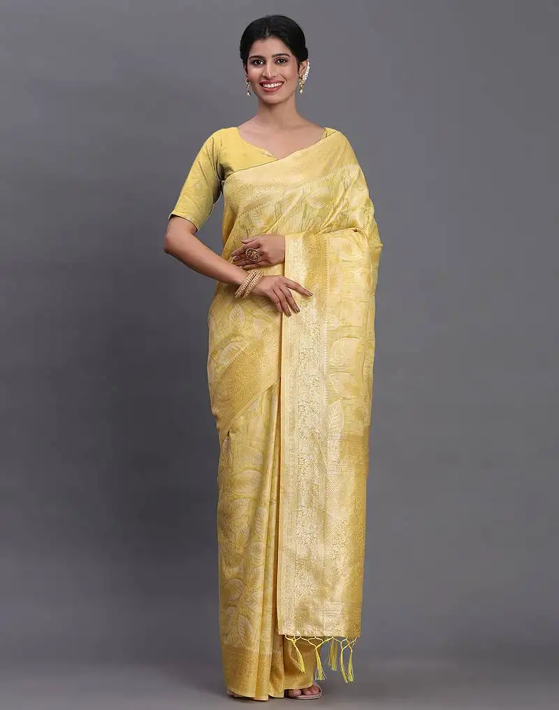 Yellow linen cotton saree with silver zari weave and tassels