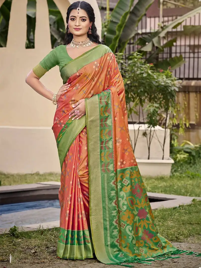 Exquisite orange green pochampalli soft silk saree with grand ikat woven pallu perfect for weddings festivals sari