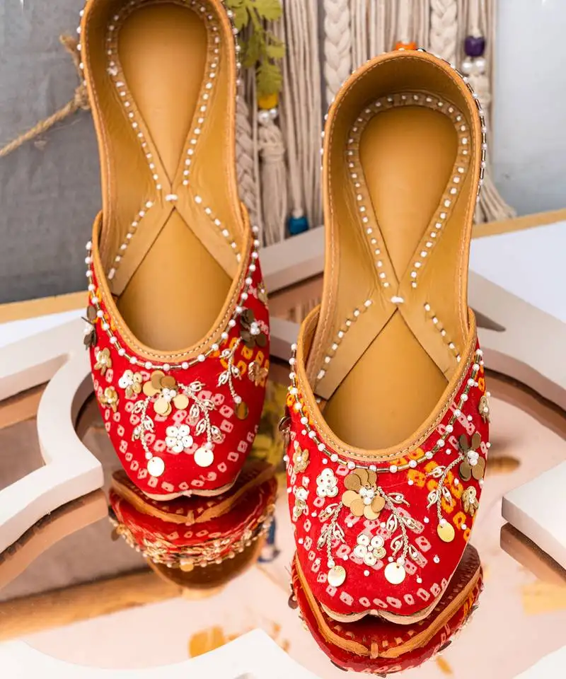 Red embroidered leather mules