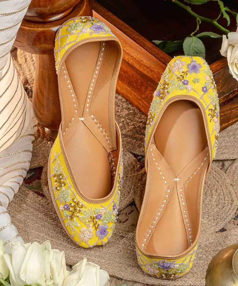 Yellow embroidered leather juttis