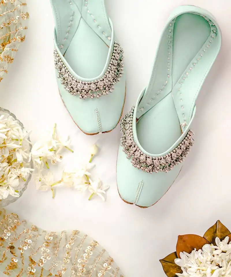 Mint green solid leather juttis