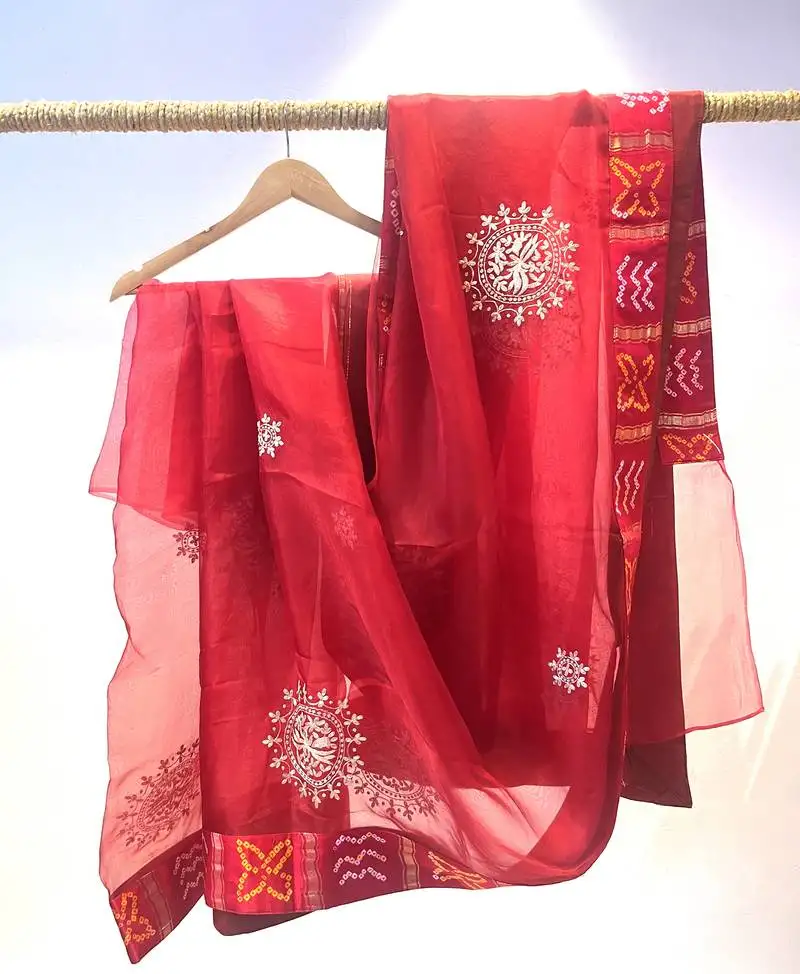Organza red saree with jajji silk blend border with blouse