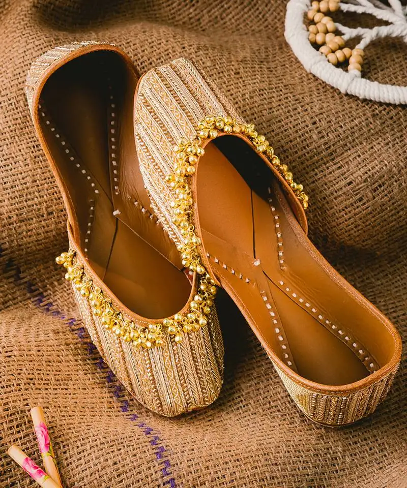 Gold pearl embroidered leather juttis
