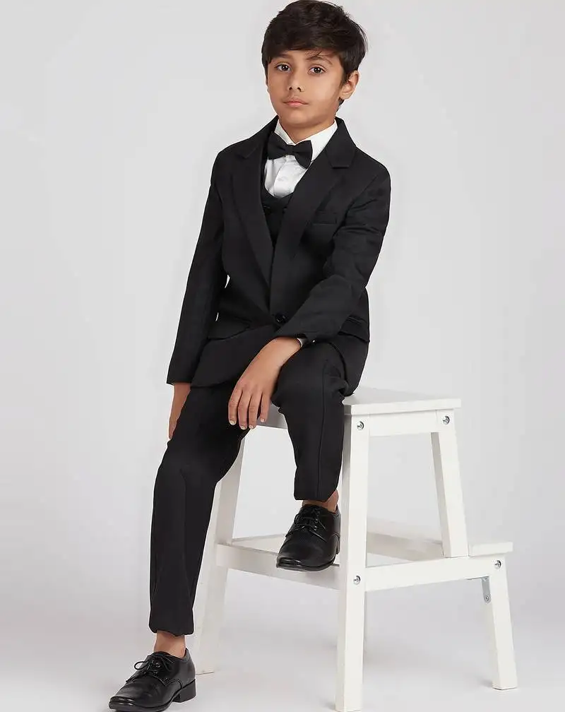 Royal look in solid suit set full sleeves blazer, shirt, pant and waist coat with bow tie - black