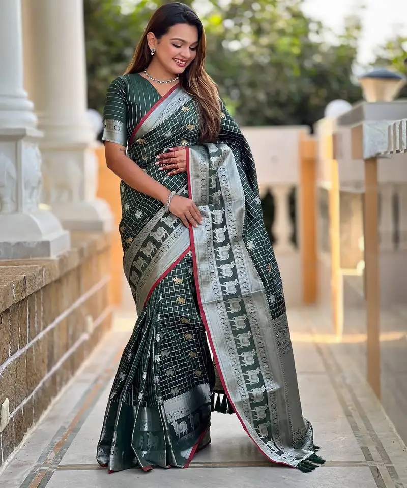 Green self design embellished silk blend saree with blouse