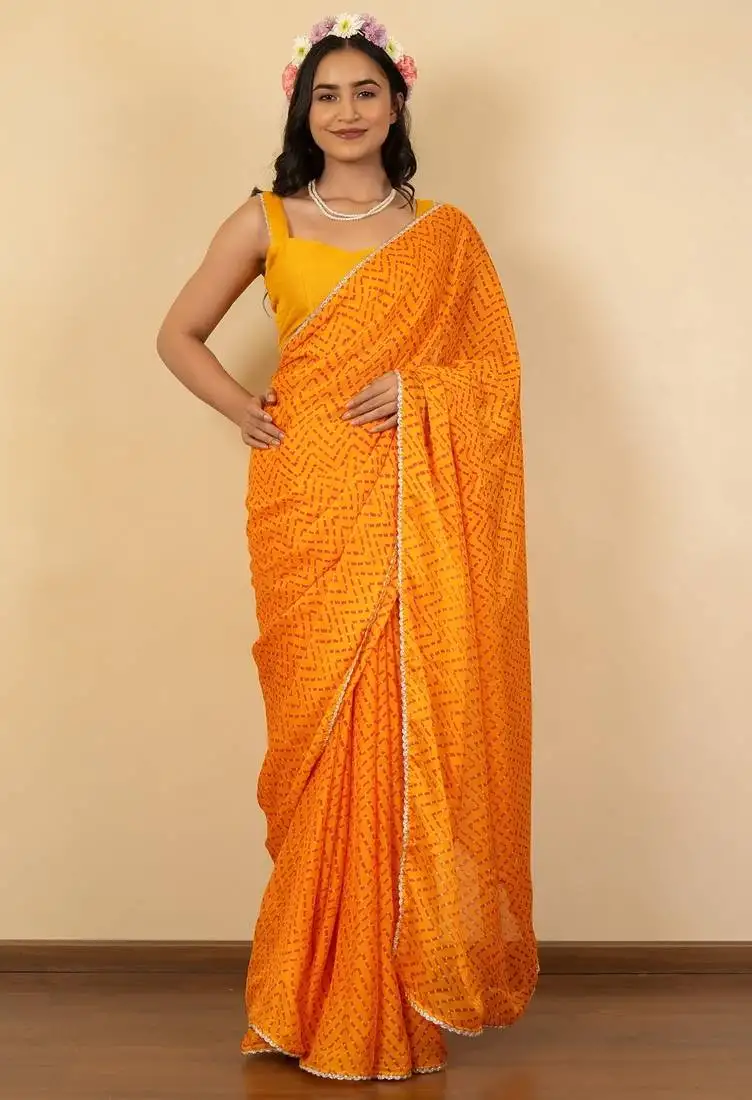 Women's bright orange chevron print golden lace border chiffon saree with unstiched blouse piece