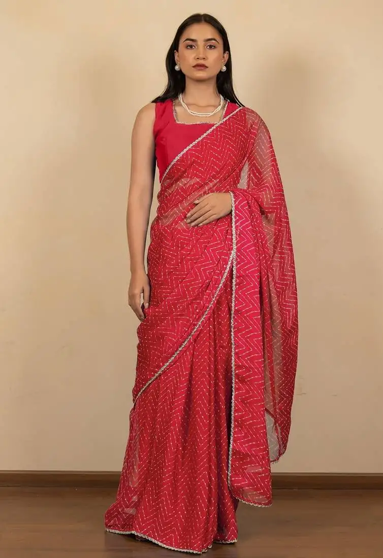 Women's red chevron print golden lace border chiffon saree with unstiched blouse piece