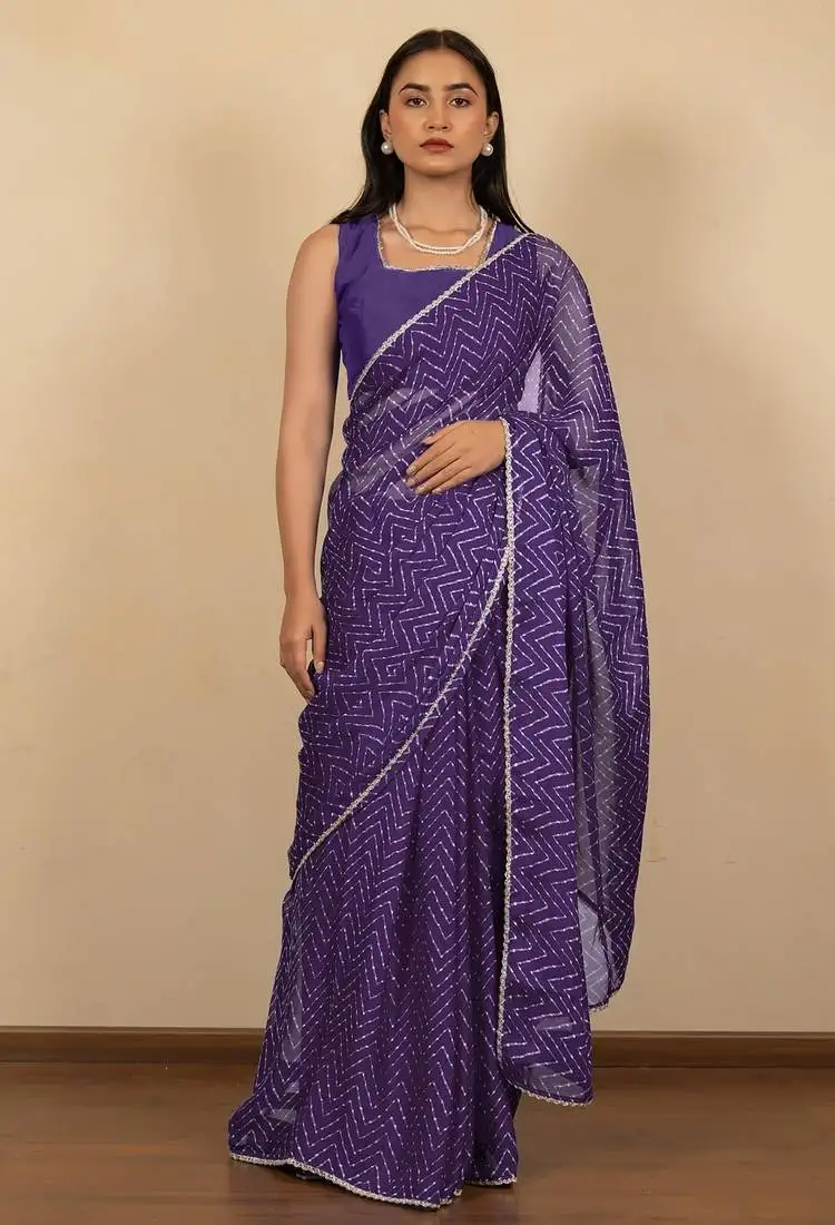 Women's purple chevron print golden lace border chiffon saree with unstiched blouse piece
