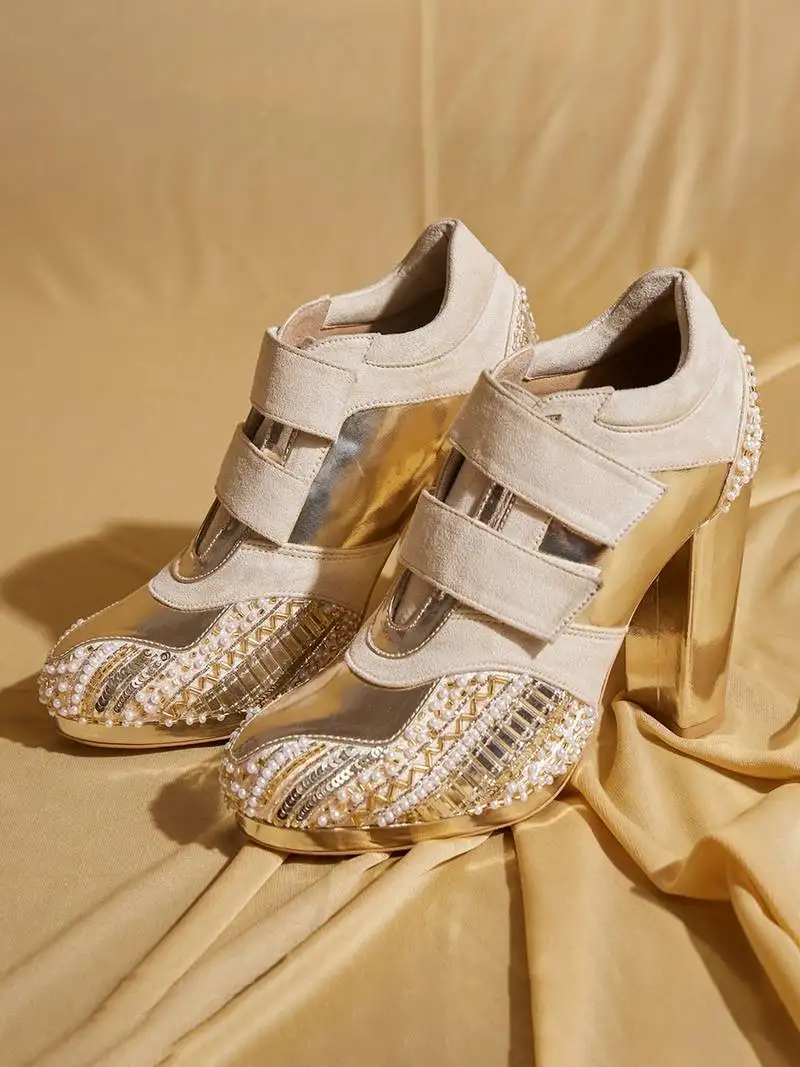 White embroidered leather heels