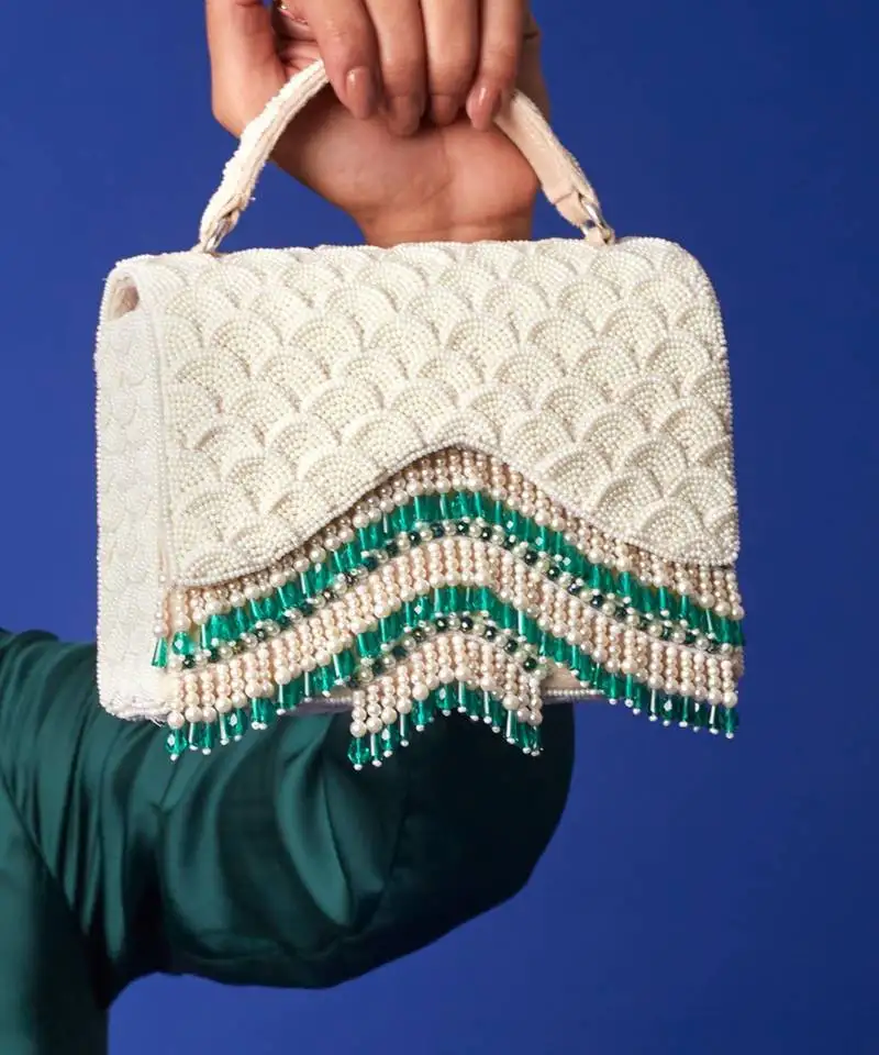 White satin handbag with pearl detailing