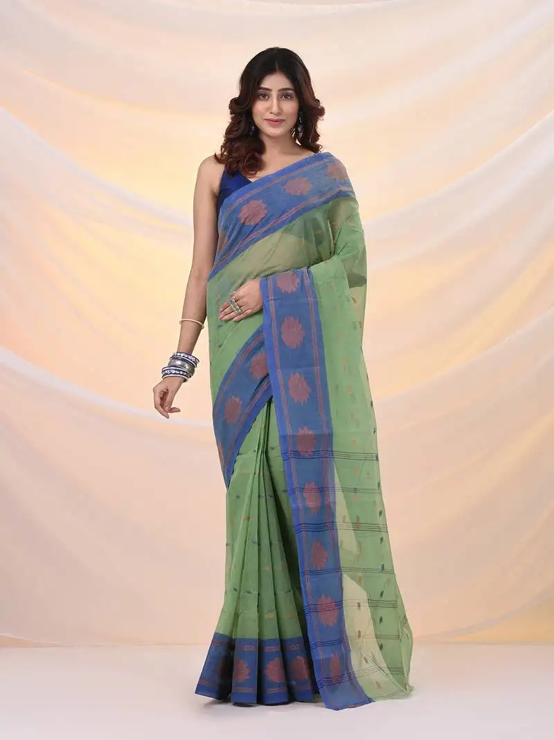 Green pure cotton tant saree with woven designs
