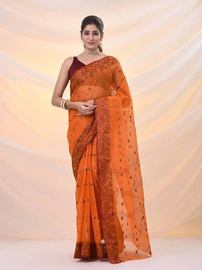 Orange pure cotton tant saree with woven designs