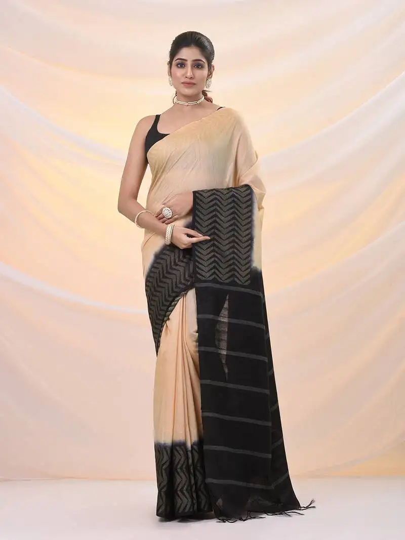 Beige silk blend saree with weaved borders