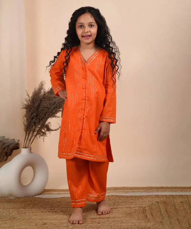 Orange cotton woven kurta paired with palazzo