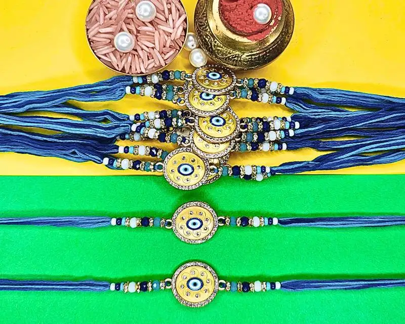 Combo of 12 evil eye cotton thread with ad stones & meenakari designer rakhi for brother