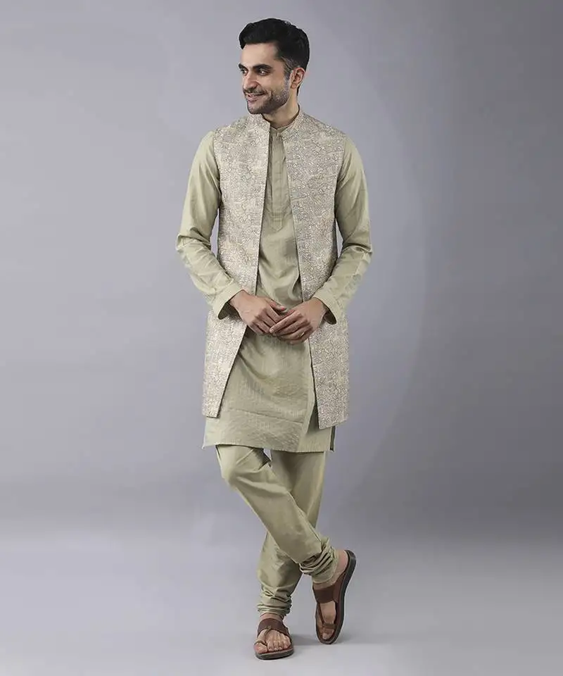 Pastel gold solid silk jacket paired with kurta & curidaar