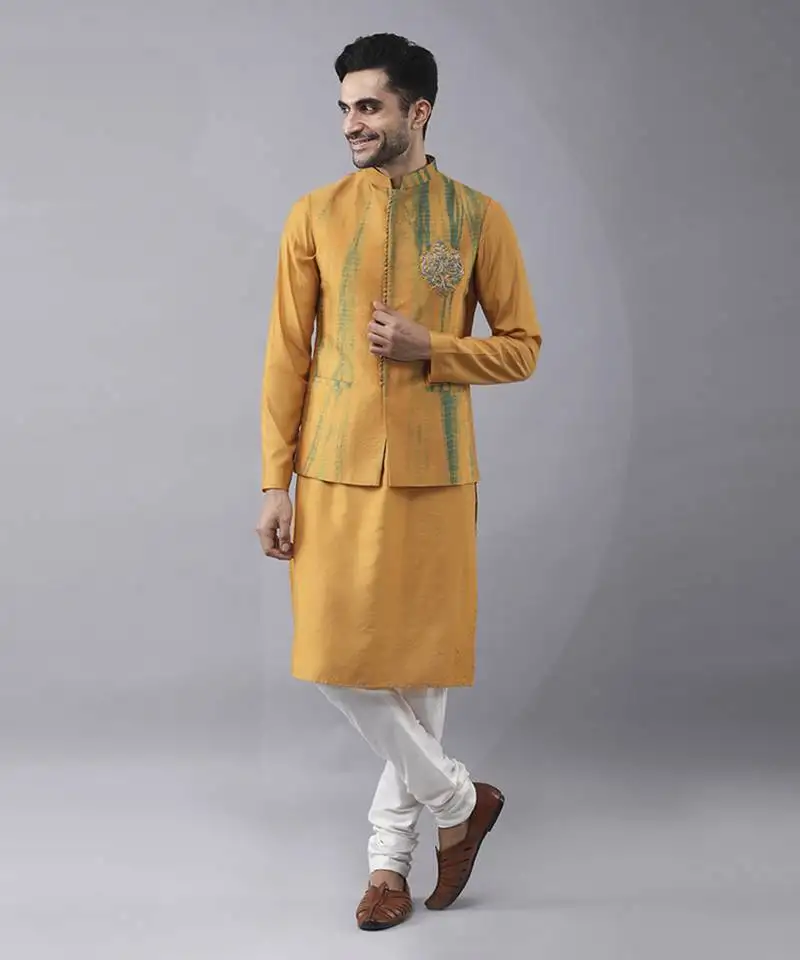 Mustard silk printed kurta jacket paired with kurta & pant