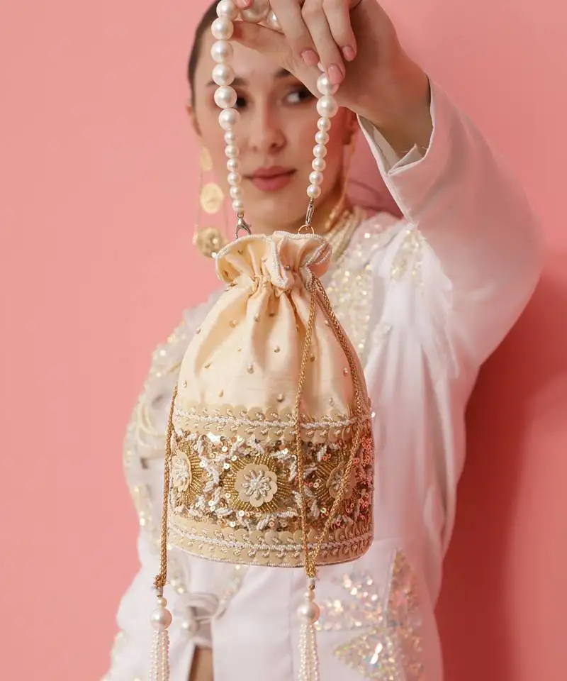 Gold silk potli bag with pearl handle