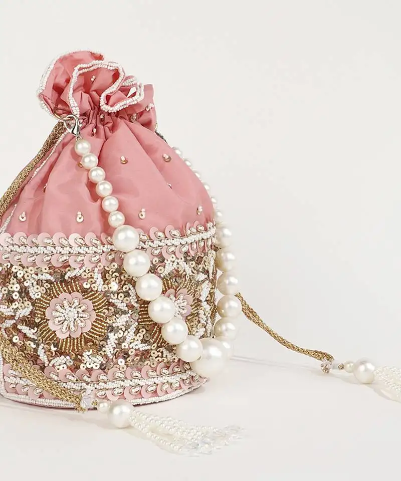 Pink silk potli bag with pearl handle
