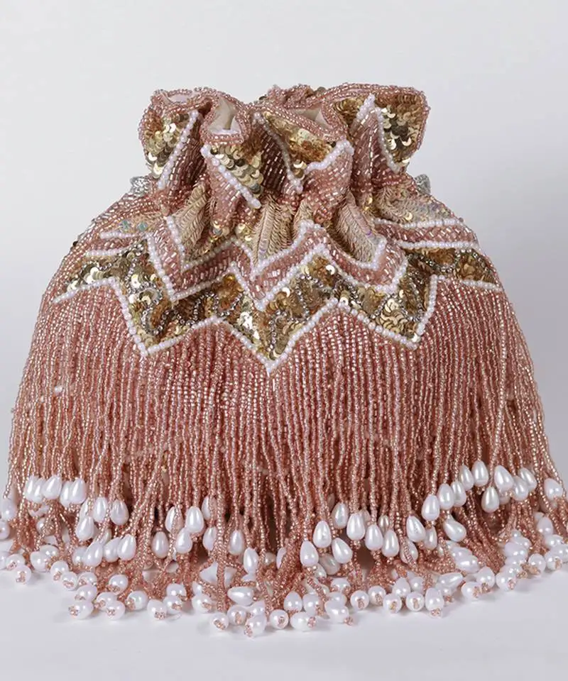 Suede pinkpotli bag with handle