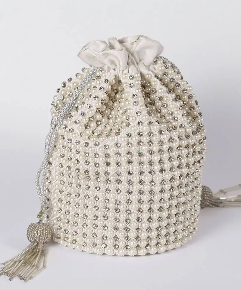 White suede potli bag with with detachable chain