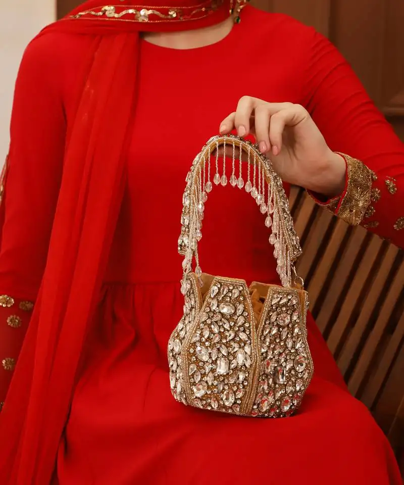 Suede gold potli bag with handle