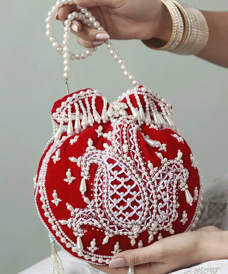 Red suede hand embroidered potli with pearl handle