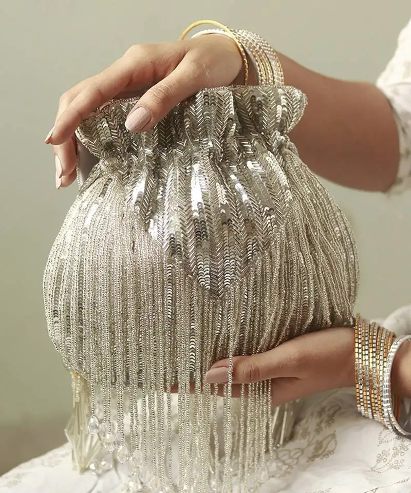 Silver silk tassles potli with handle