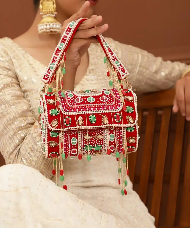 Red suede flap over clutch bag
