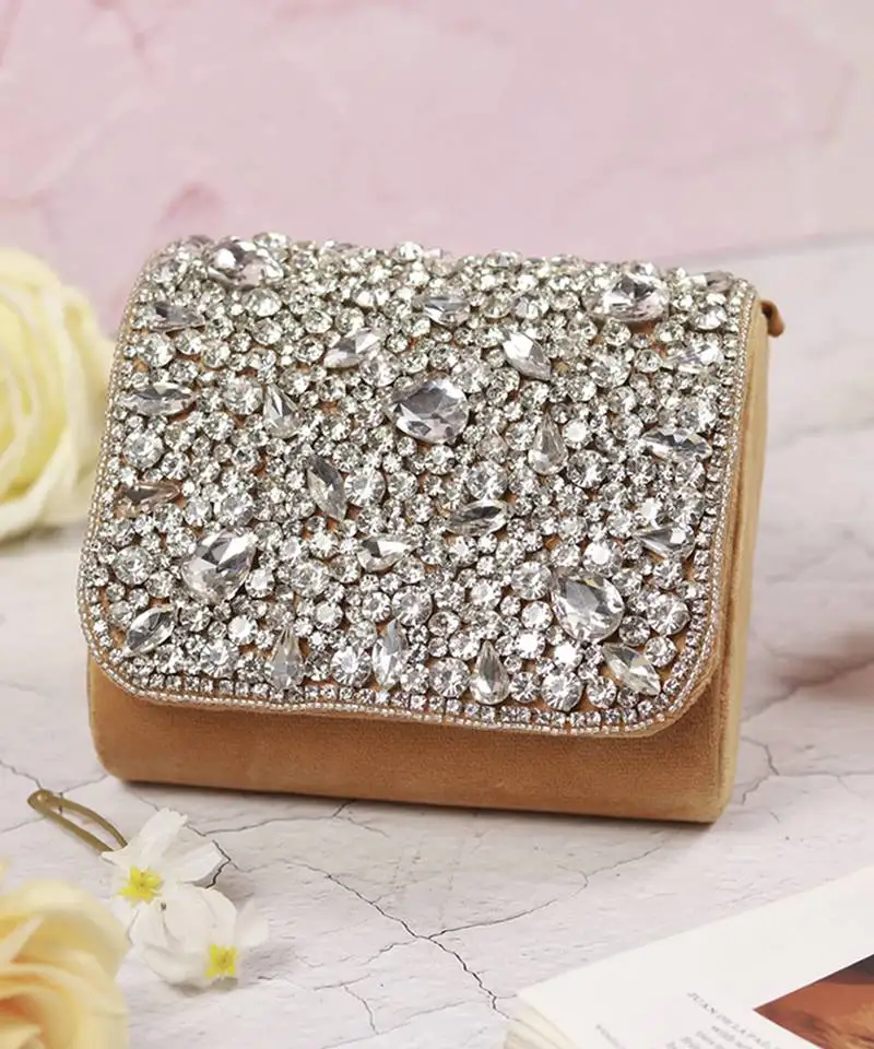 Gold suede mini bag with embroidered handle