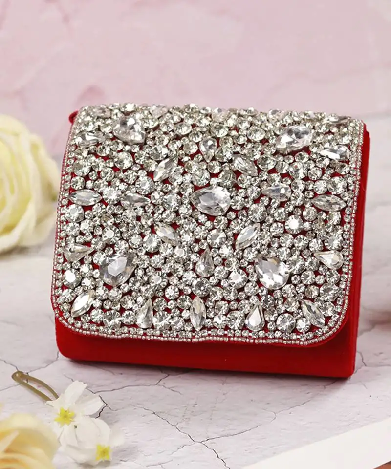 Suede red mini bag with embroidered handle